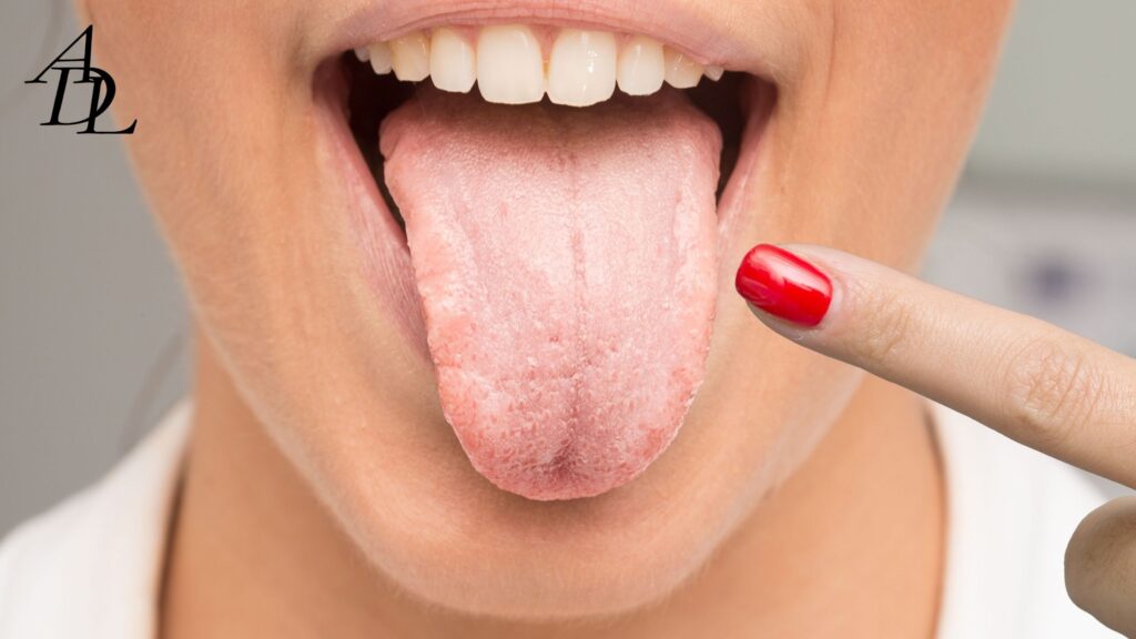 Women putting her tongue out and pointing at it. 