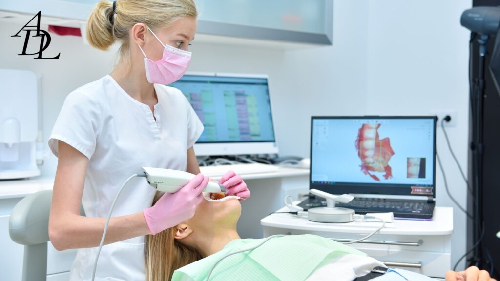 Doctor with Blonde Hair doing an intra oral scan on a patient. 